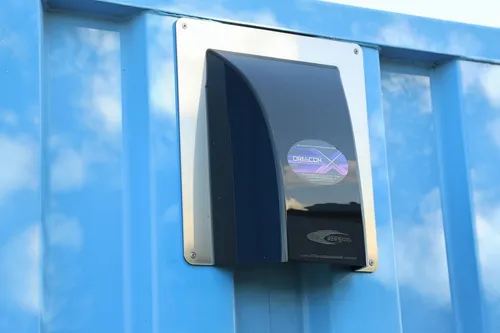 Close-up of an installed black DRY-CON X intake vent on a shipping container