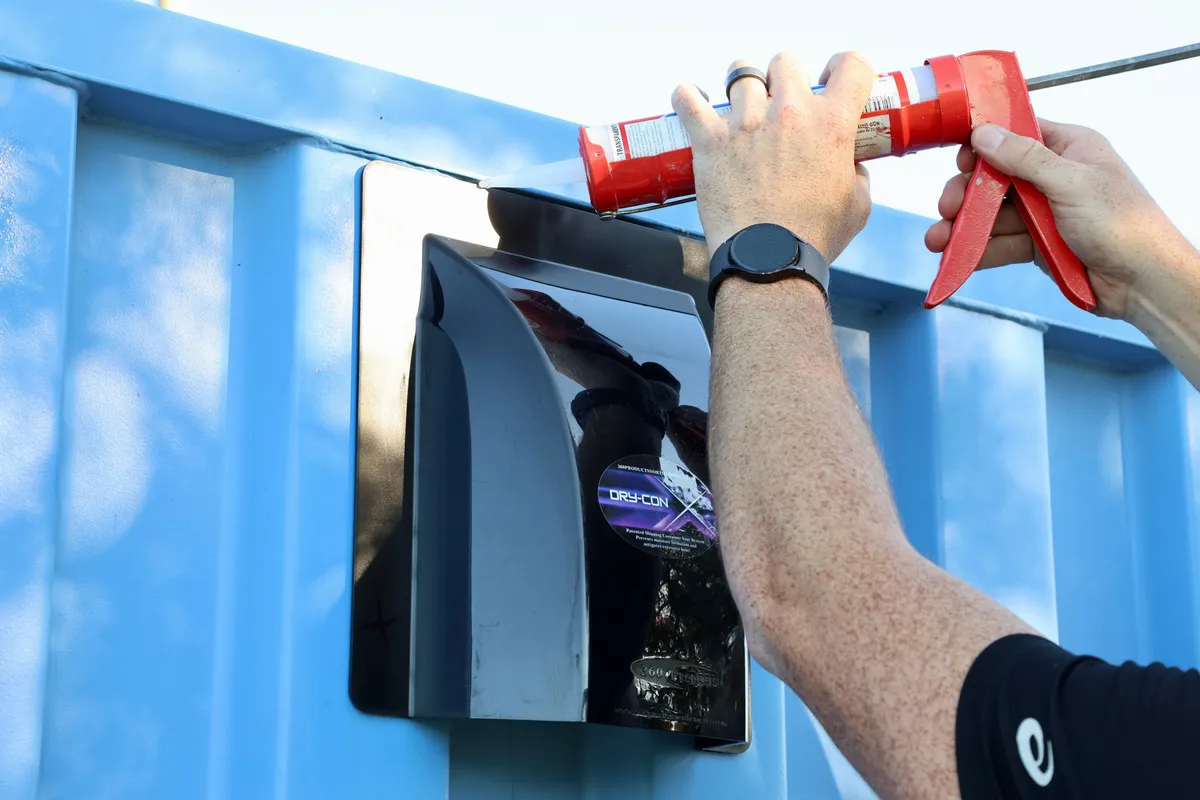 Sealant being applied around a DRY-CON X vent opening