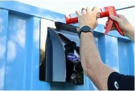 Exterior sealant being applied at the top of an installed DRY-CON X vent